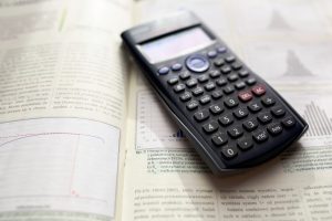 Image of a book and calculator